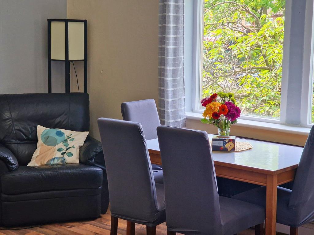 Bright and inviting living/dining area with a l...