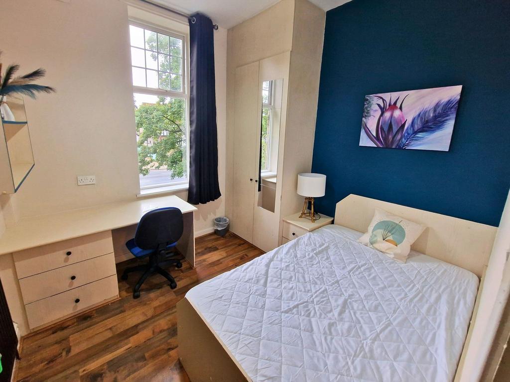 Bright, neatly presented bedroom with a double ...