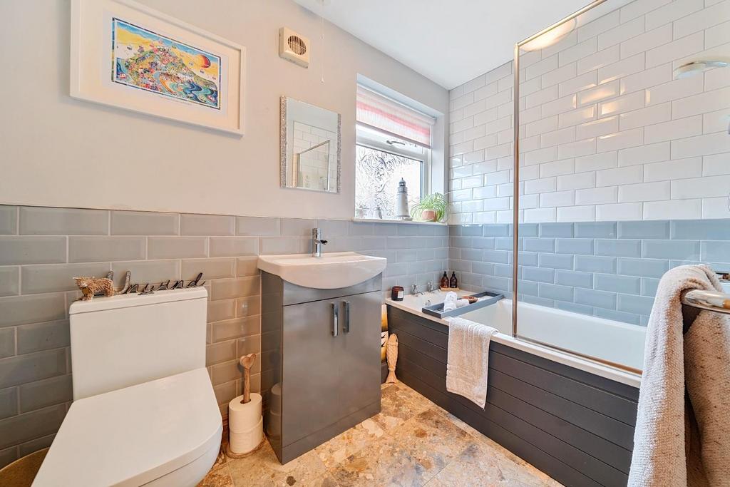 DOWNSTAIRS BATHROOM with shower over bath.jpg