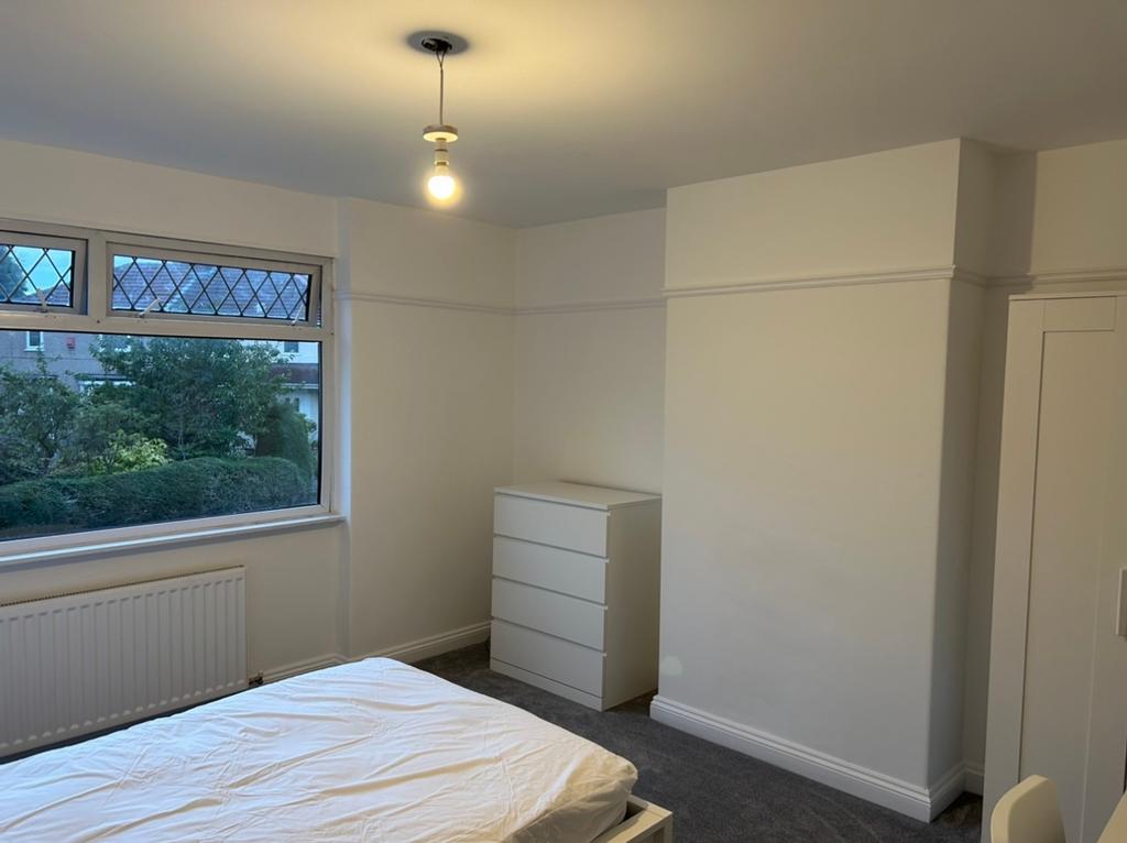 A bright and spacious double bedroom with lovel...