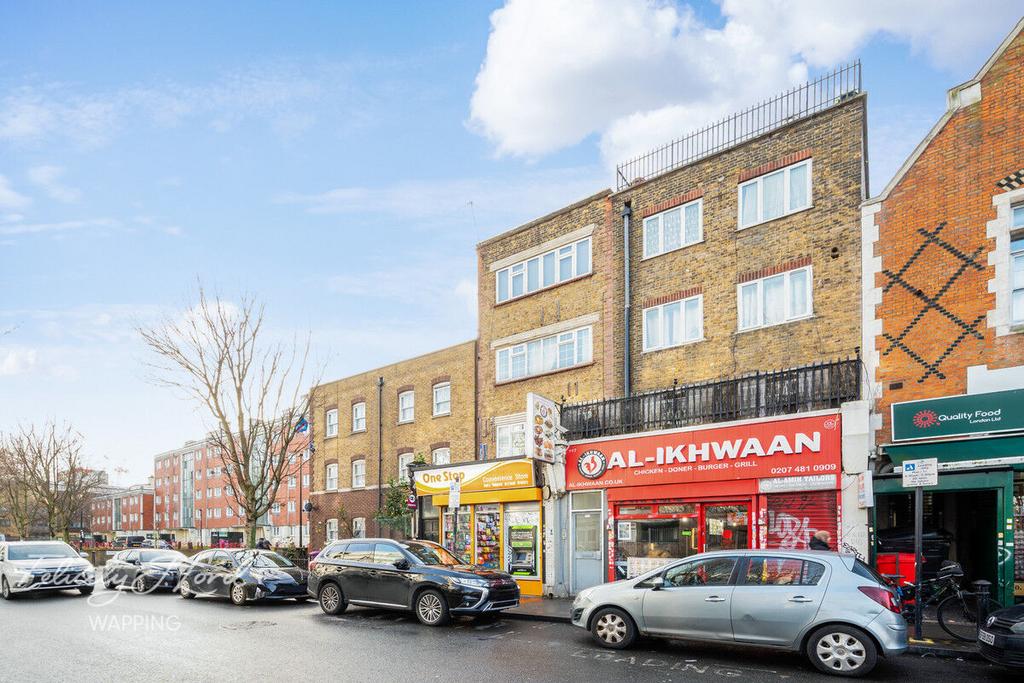 Street scene with property, parking