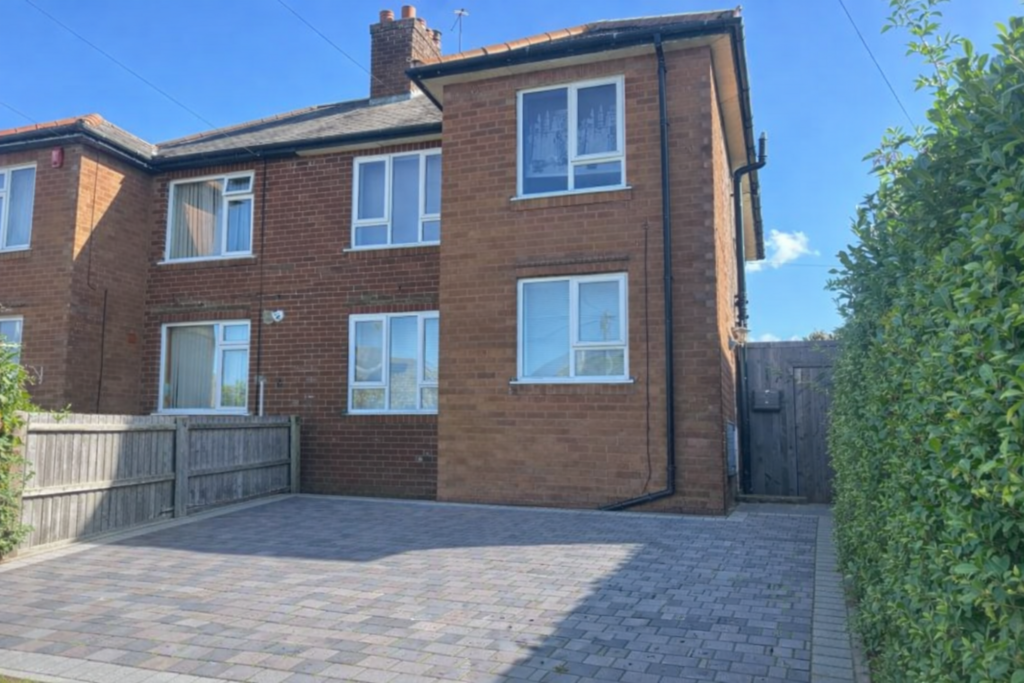 Front elevation (driveway added for illustration p