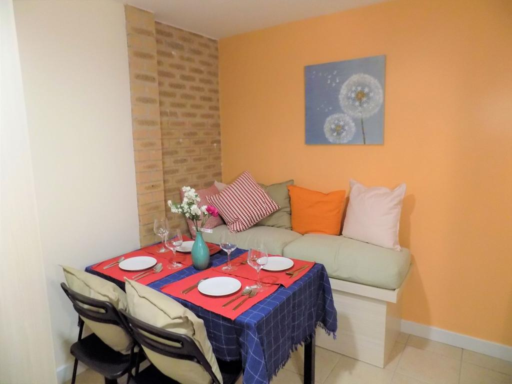Bright, cosy communal lounge/dining nook with a...
