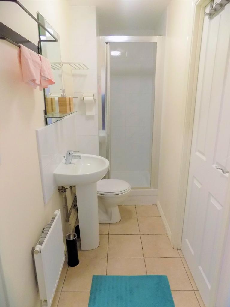 Bright, tidy bathroom with a walk-in shower, pe...