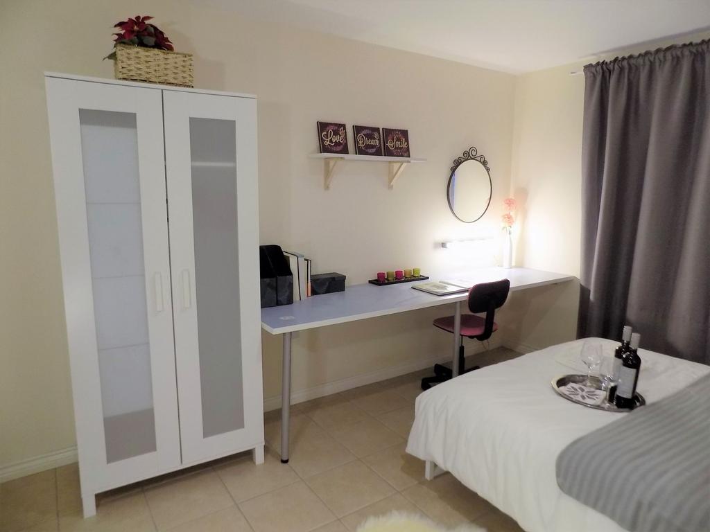 Neat, well-lit single bedroom with a long study...
