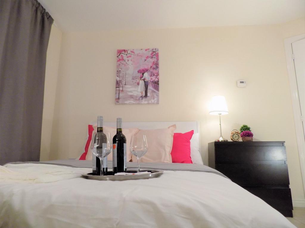 Bright, neatly styled double bedroom with a com...