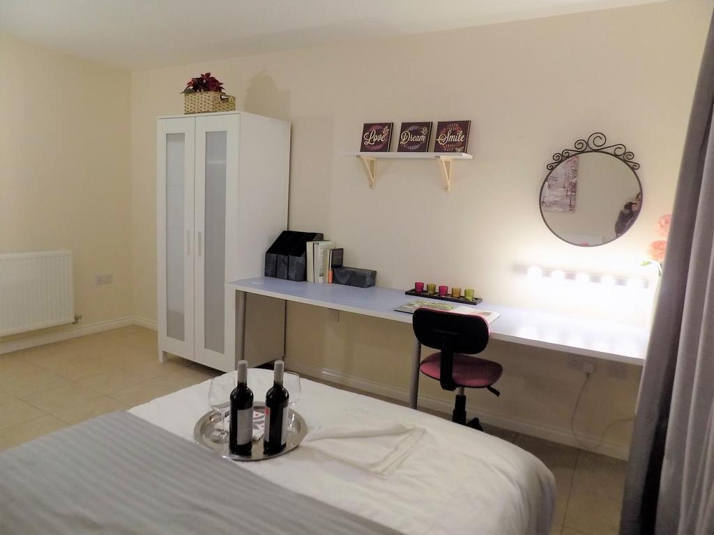 Bright, neatly presented bedroom with a long st...