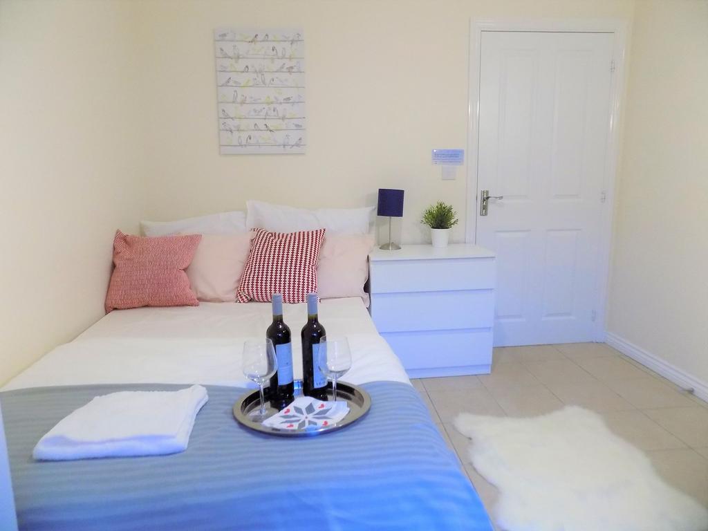 Bright, neatly styled bedroom with a double bed...