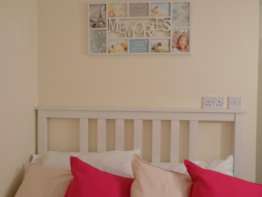 Bright, neatly presented bedroom with a white s...