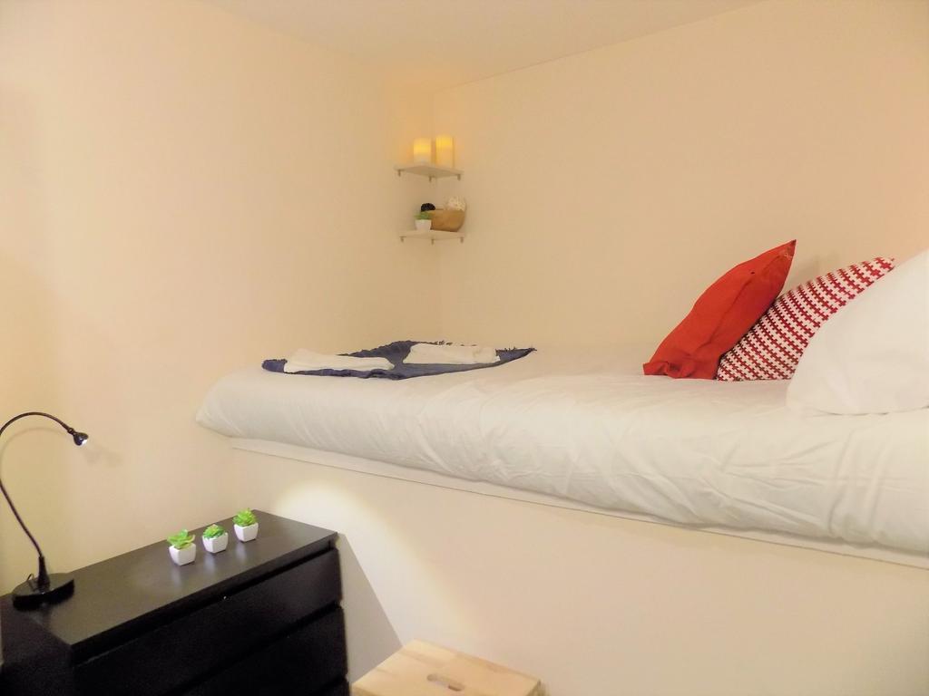 Cosy single bedroom with a raised bed dressed i...