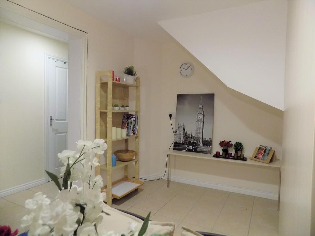 Bright, simply styled living area with neutral ...