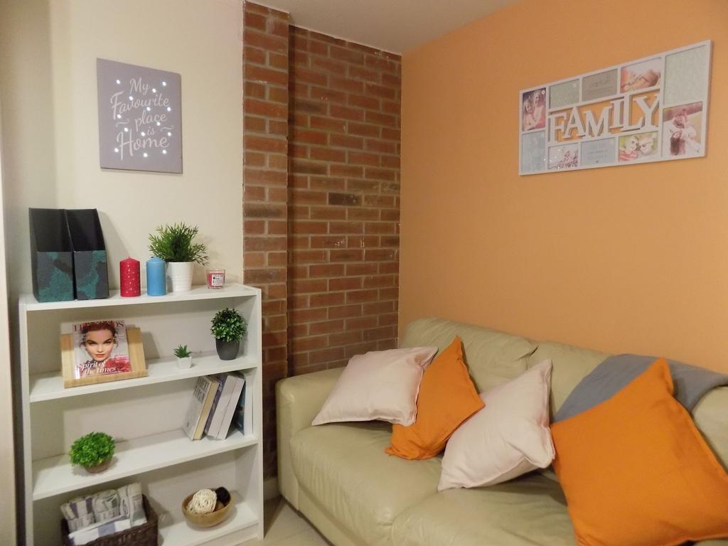 Bright, cosy living area with a neutral leather...
