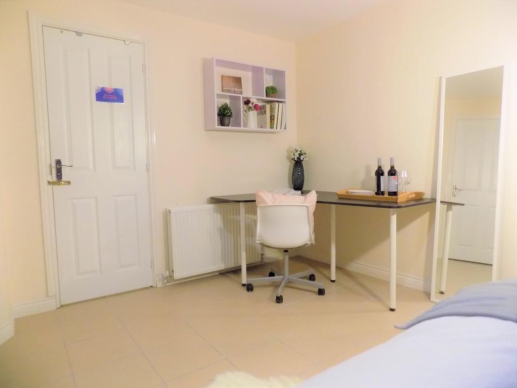 Bright, tidy bedroom corner with a practical L-...
