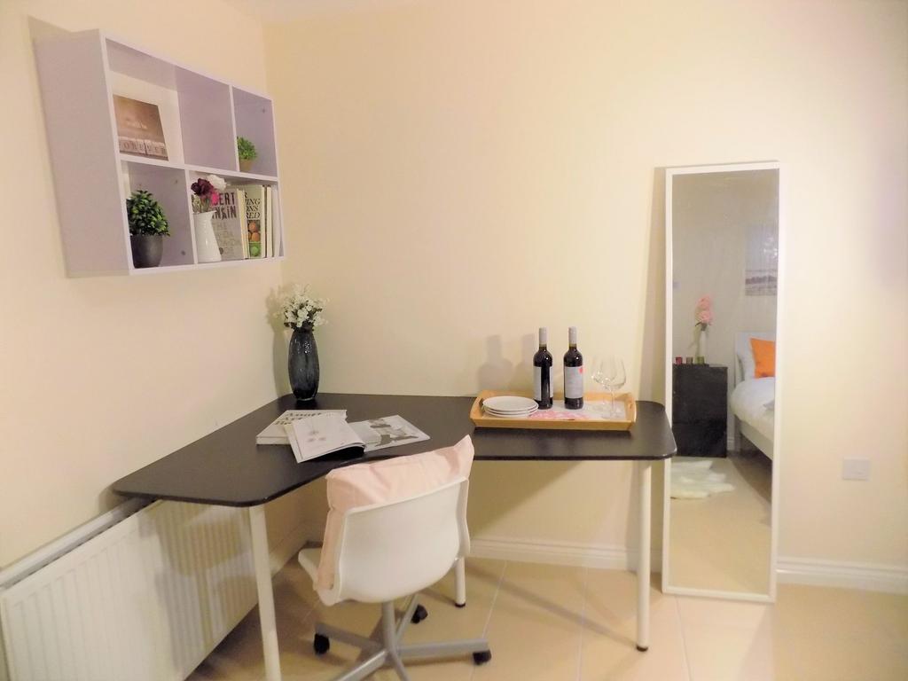Bright, neatly styled bedroom corner with a mod...