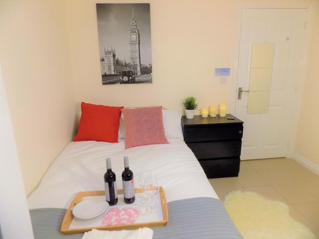 Bright, neatly styled bedroom with a comfortabl...