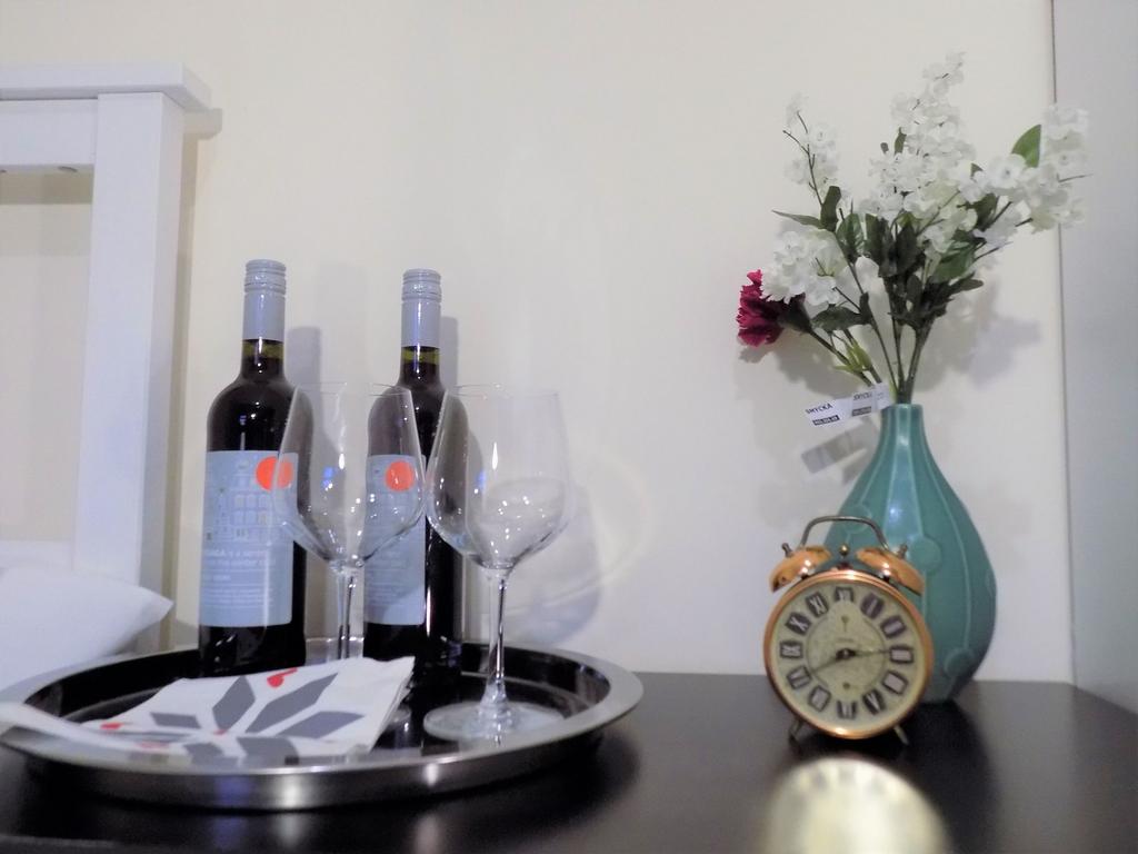 Stylish bedside arrangement with a decorative v...