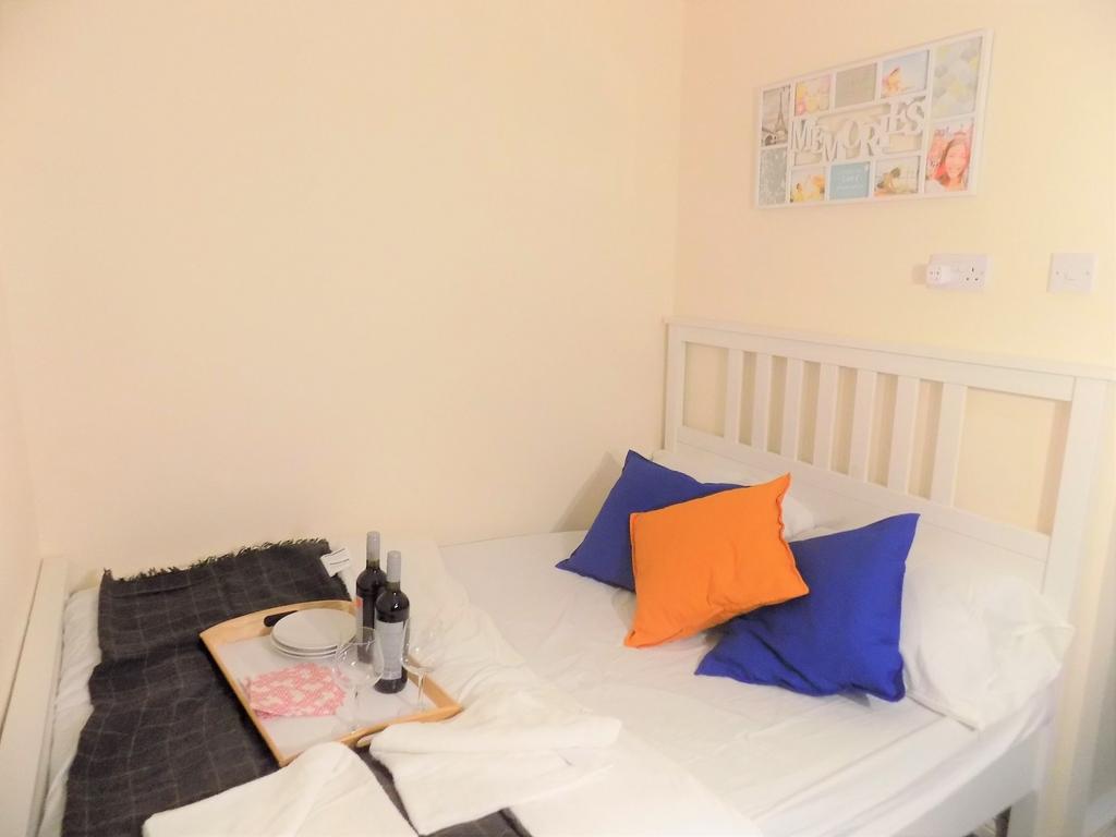 Bright, neatly presented bedroom with a white w...