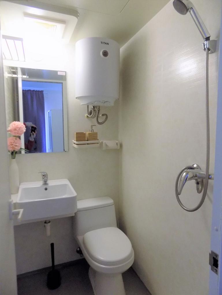 Compact, neatly presented bathroom with a wall-...