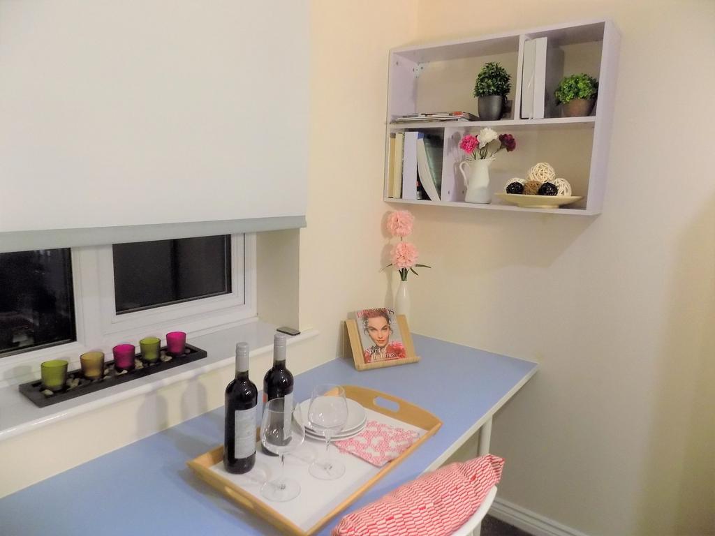 Neat study nook with a light blue work surface,...