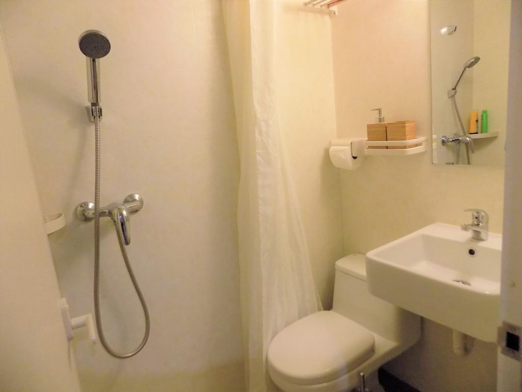 Compact, well-kept bathroom with a wall-mounted...