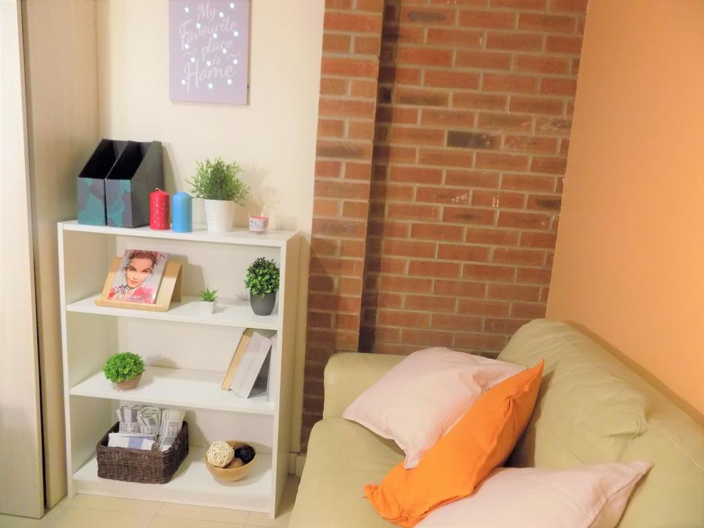 Cozy living area with a comfortable pale sofa d...