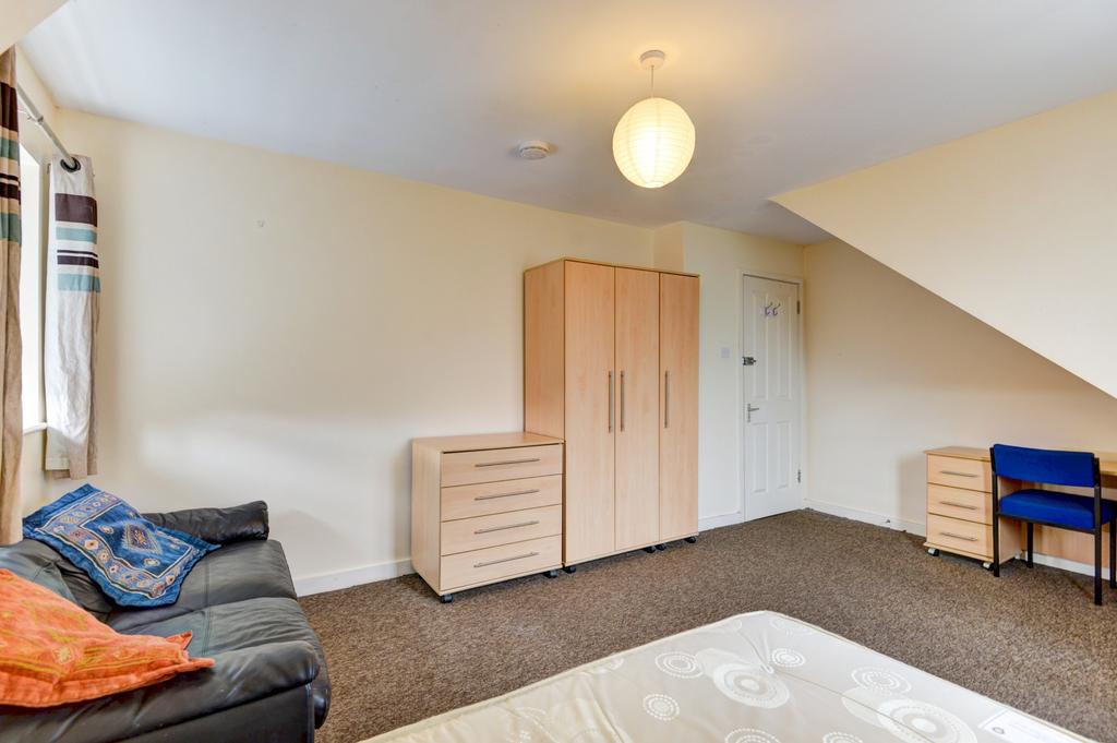 A bright, well-maintained bedroom featuring neu...