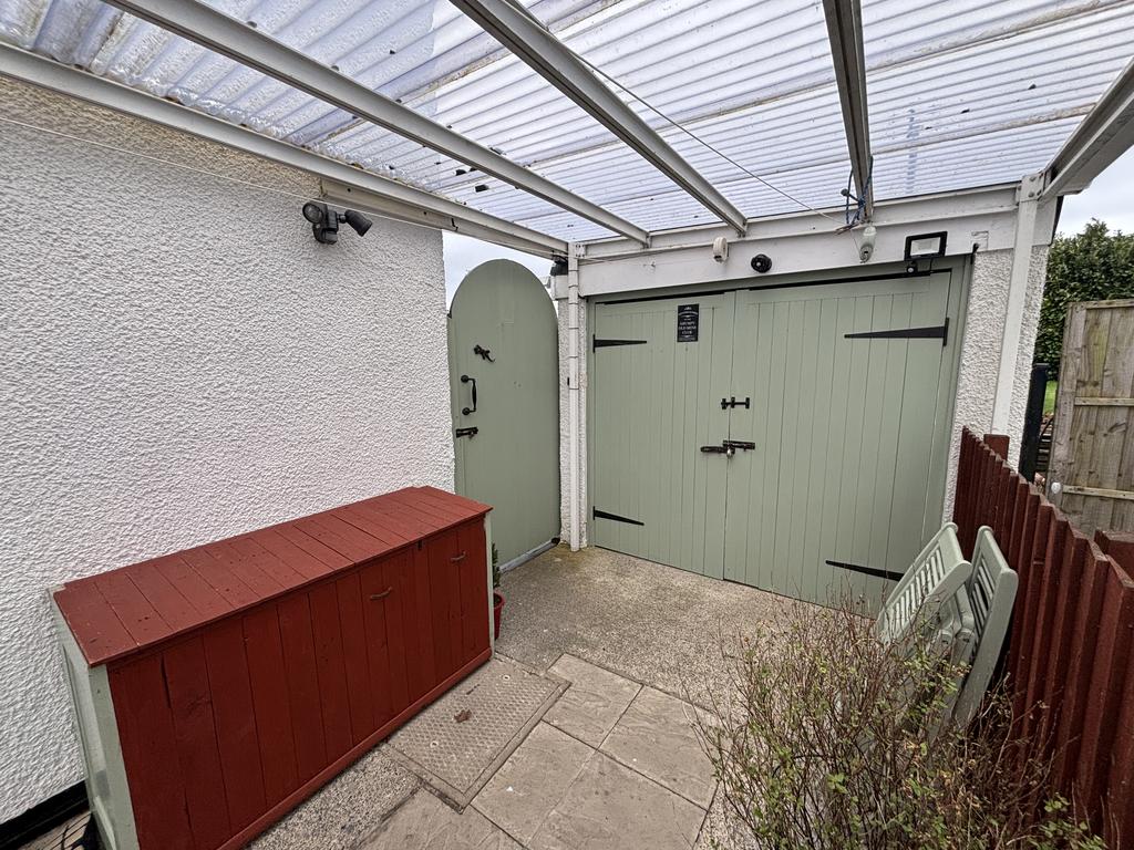 Detached garage and car port