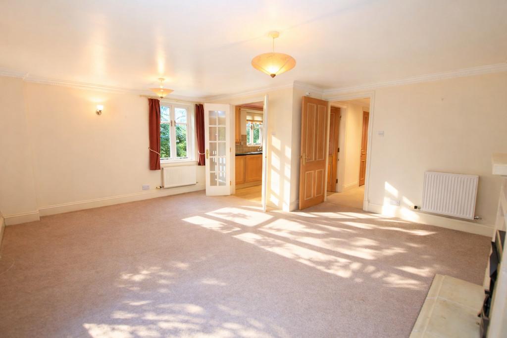 Sunlit living room with open doors