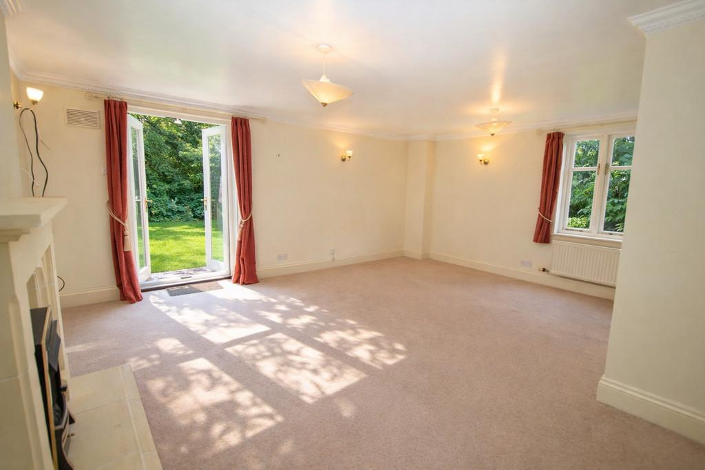 Bright living room with open French doors