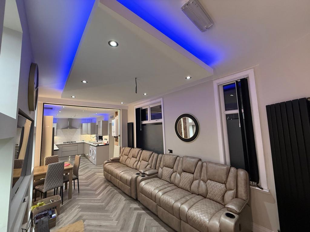 Stylish open-plan living area with a long, comf...