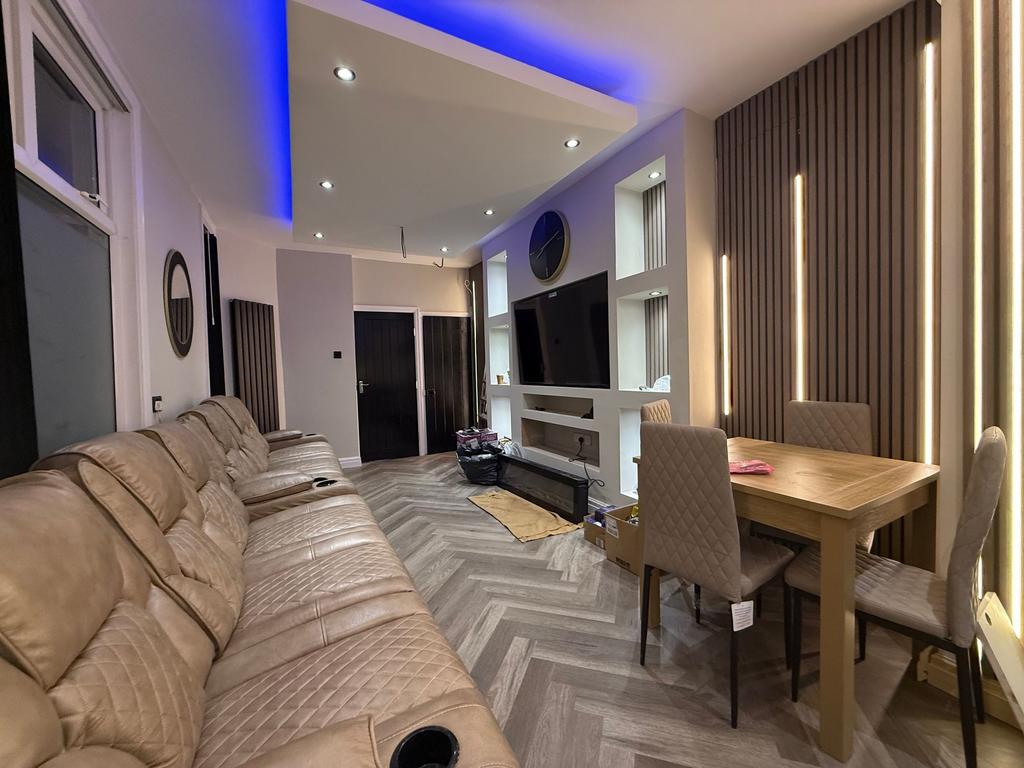 Contemporary open-plan living room with a long ...