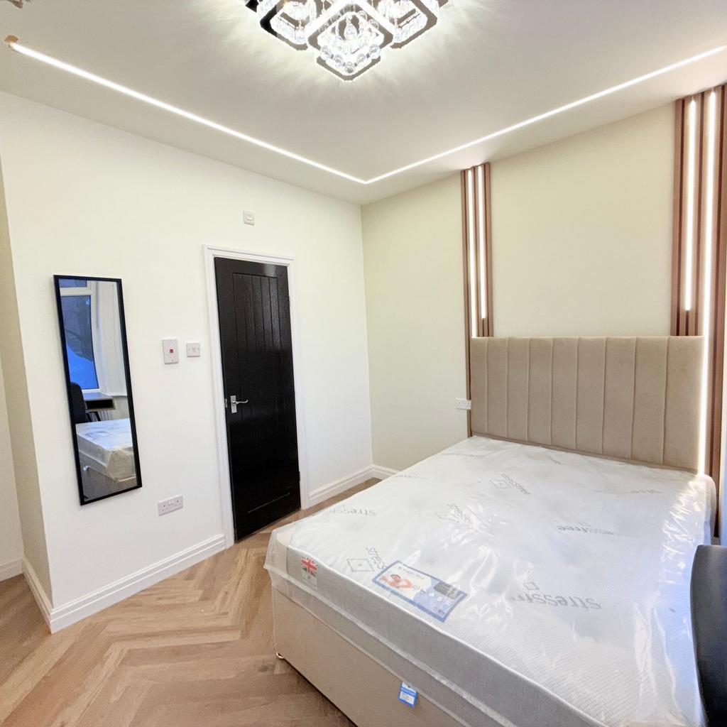 Bright, modern double bedroom with a stylish up...