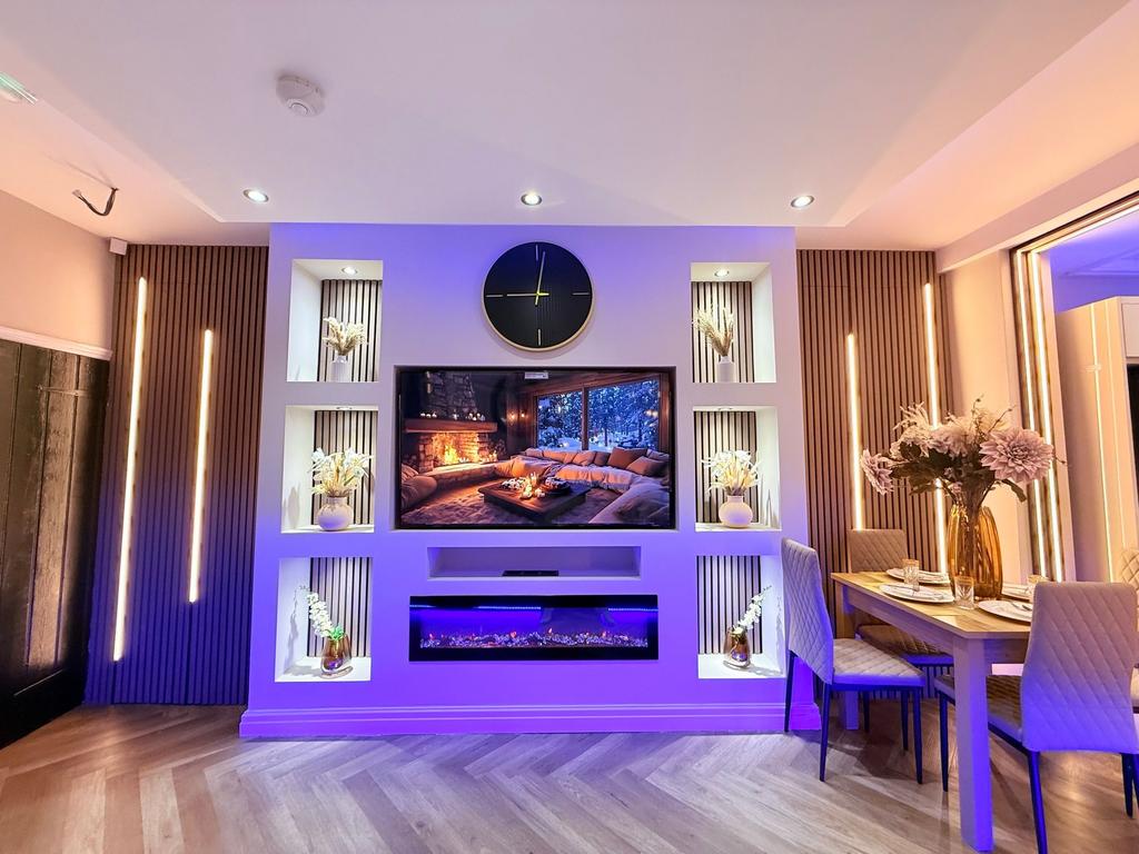 Stylish modern living and dining area with buil...