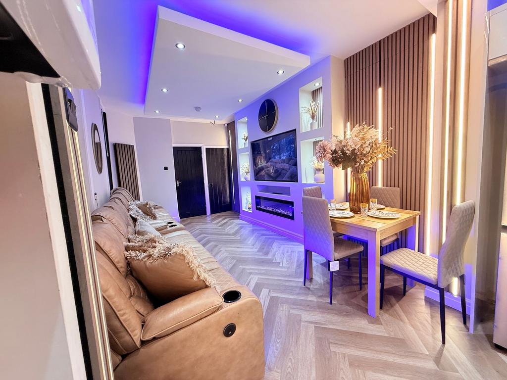 Contemporary open-plan living room with a long ...