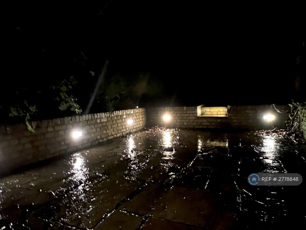 Rainy Lit Patio Off Dining Area