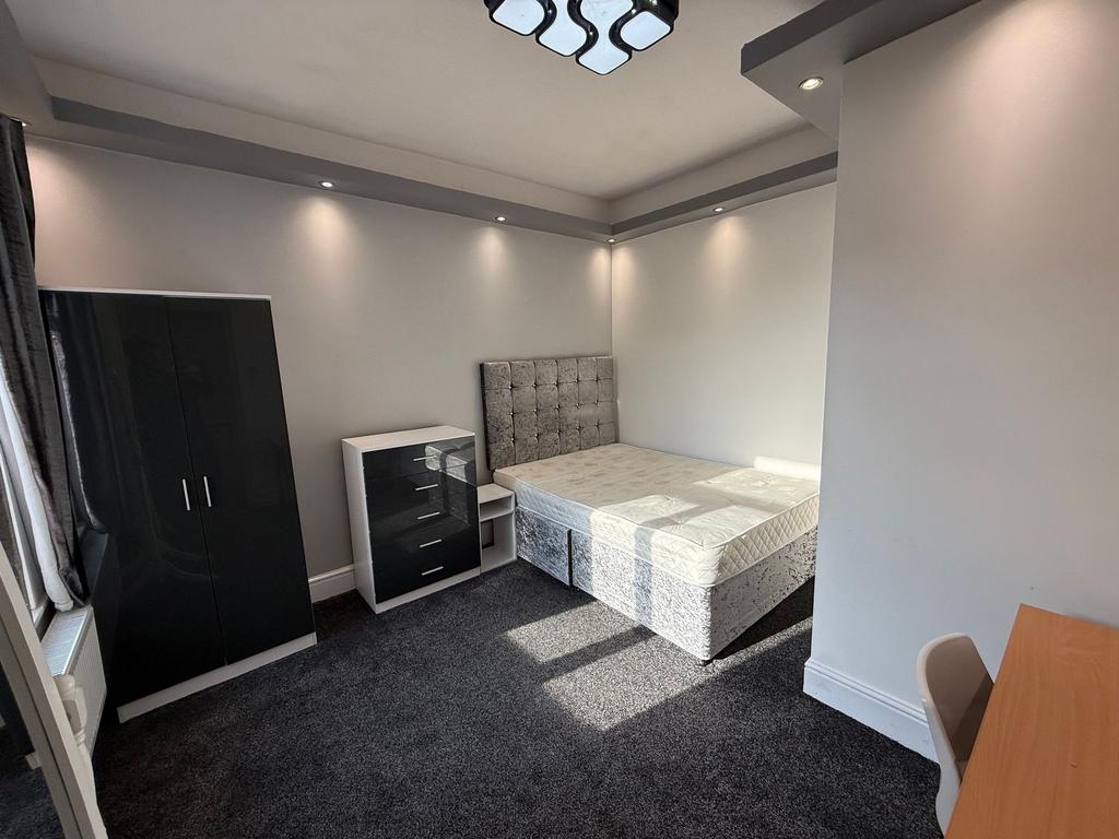 Bright, modern bedroom with a comfortable doubl...