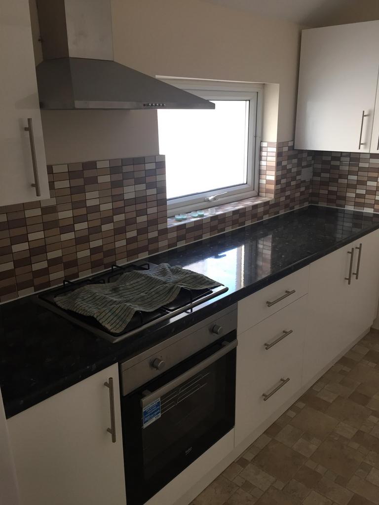 A tidy kitchen with modern fixtures and good li...