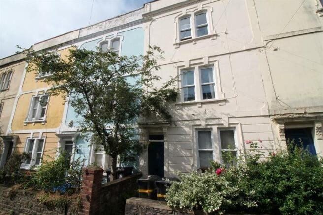 Charming terraced house frontage with period fe...