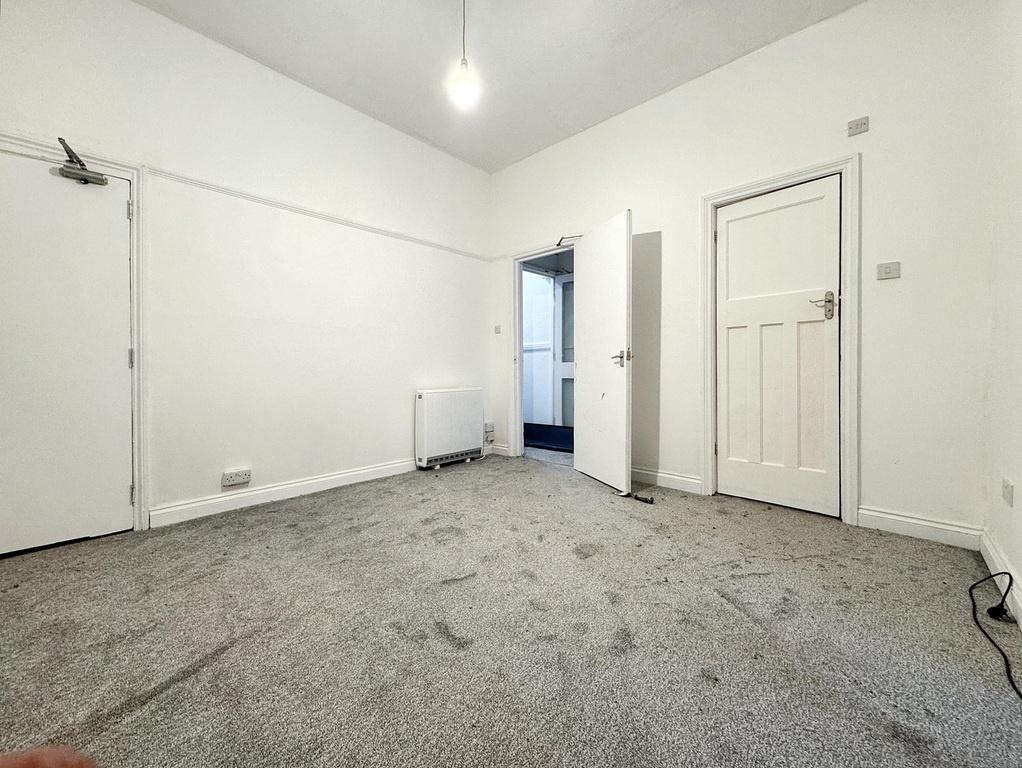 Bright, neutral bedroom with fresh white walls,...
