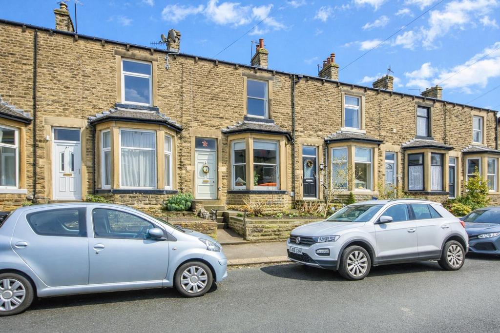 Terraced houses under a blue sky.png