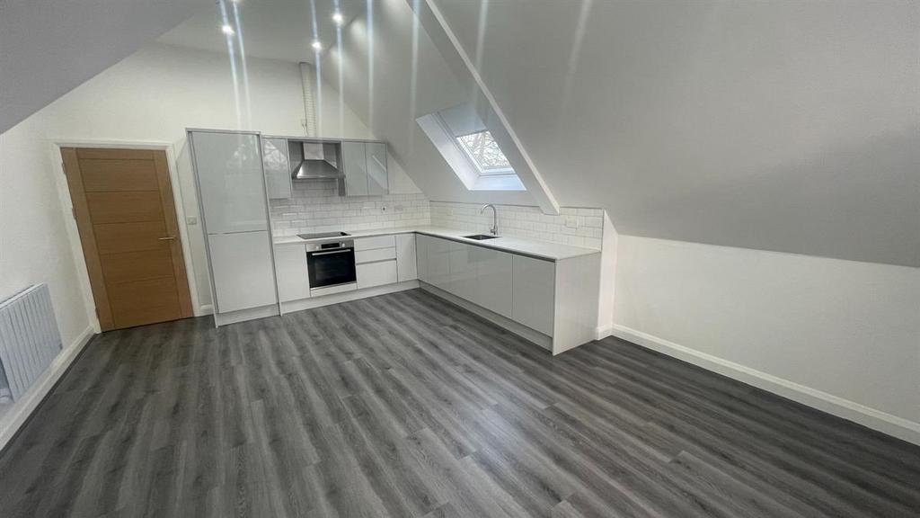 Bright, modern open-plan kitchen in a refurbish...