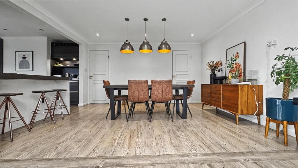 Bright, modern open-plan living and dining spac...
