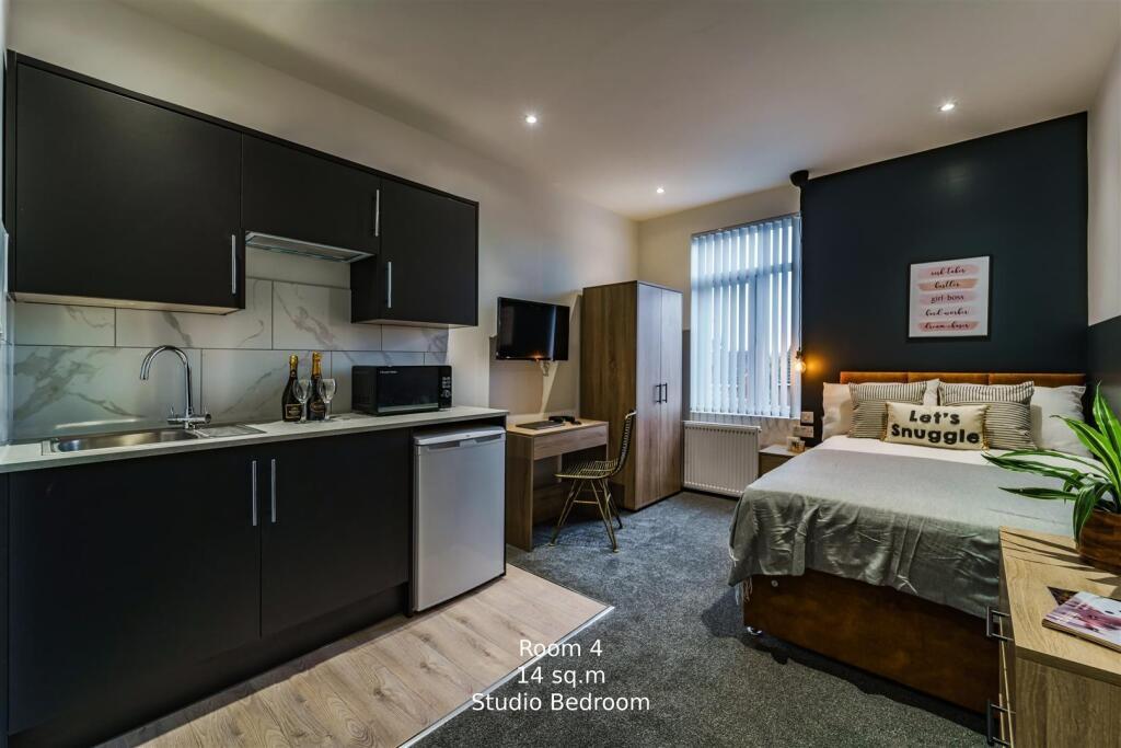 Modern double bedroom with integrated kitchenet...