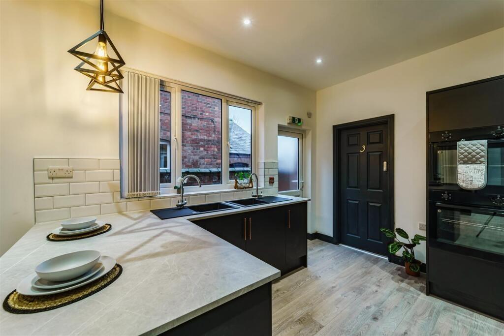 Modern kitchen with a central island breakfast ...