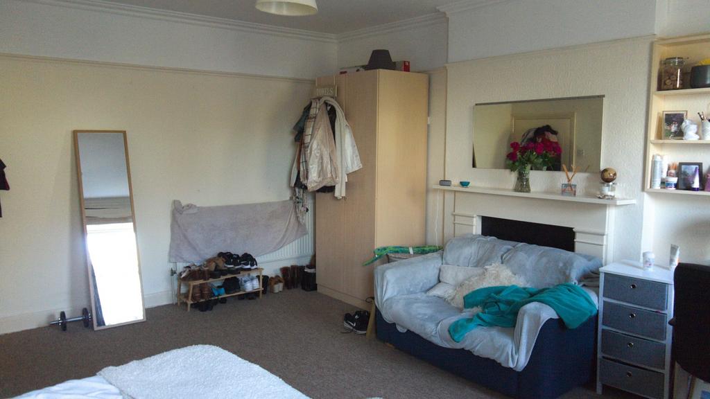 A spacious and inviting double bedroom with goo...