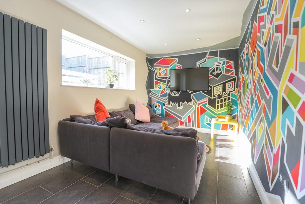 A vibrant and modern living room featuring a co...