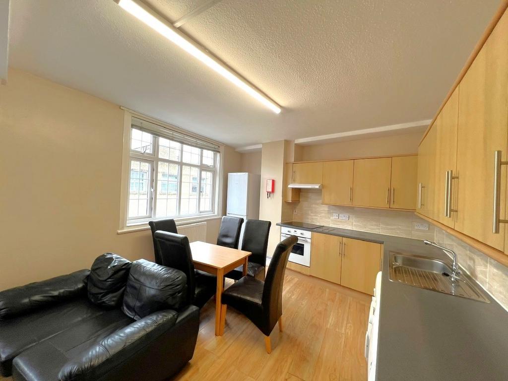 Bright and welcoming kitchen with ample natural...