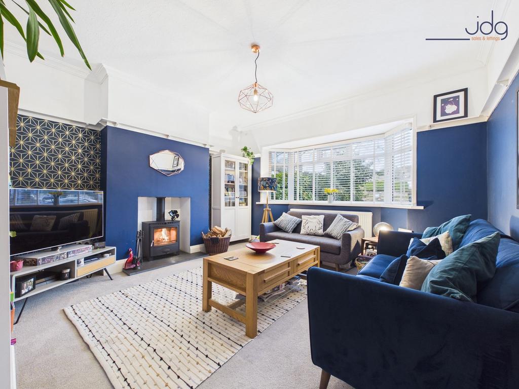 Cosy Lounge with Multi Fuel Stove and Bay Windows