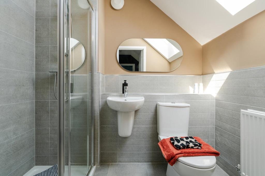 The top floor is complete with a shower room