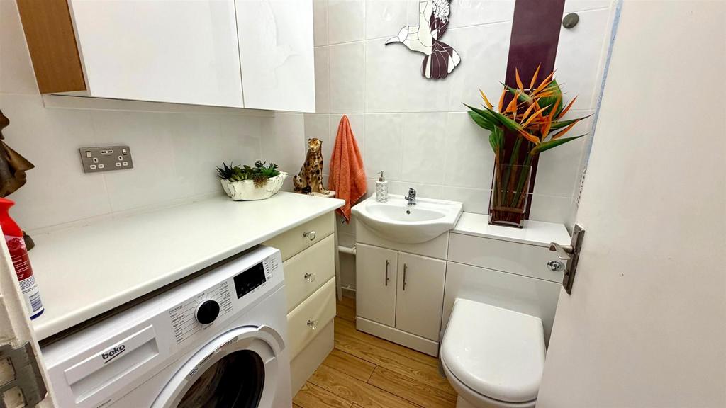 Tiled utility/ cloakroom
